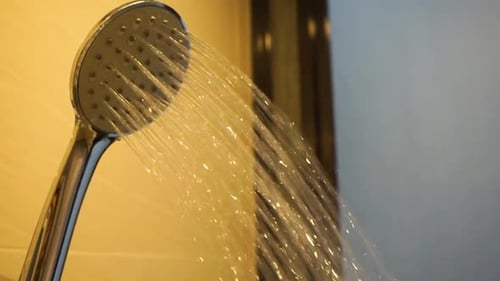 Shower Head Streaming Water Close Up