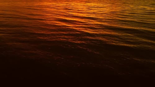 Golden Sunset Over Gentle Ocean Waves