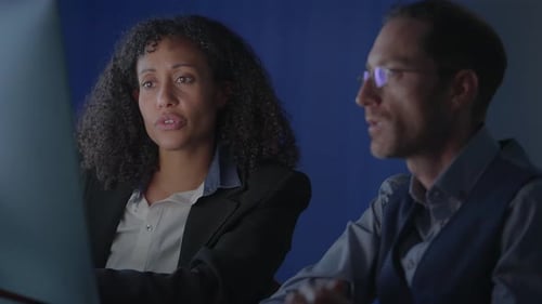 Two Skilled Professionals Collaborating Effectively in a Modern and Innovative Workspace