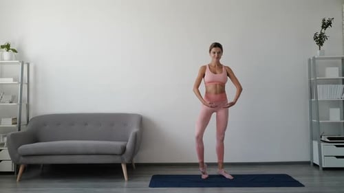 Young Woman Exercising Core Balance At Home