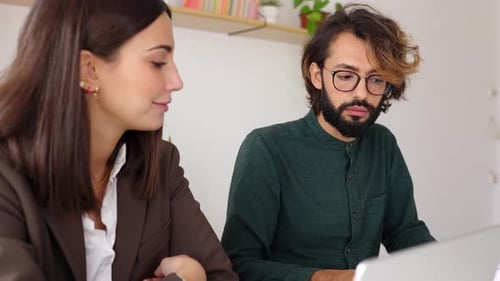 Young Trendy Business People Working Together on Laptop in the Office