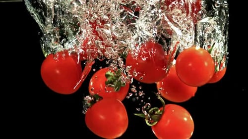 Tomatoes Fall Under Water Filmed on a Highspeed Camera at 1000 Fps