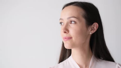 Portrait of a Beautiful Middleaged Brunette on a White Background