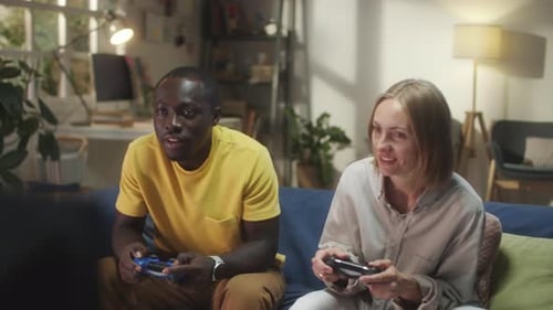 Couple Playing Video Games Together at Home