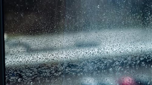 Rain Drops on Window in the City