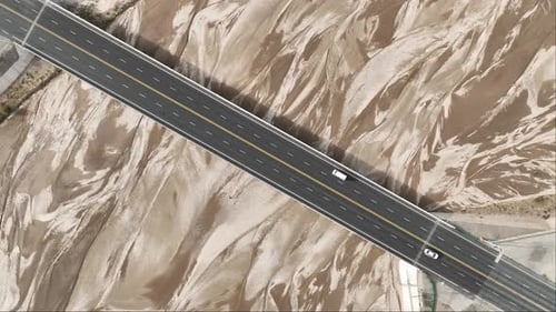 Aerial view of bridge over desert terrain, China.