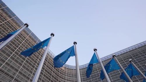 EU Flags Waving Outside Modern Building