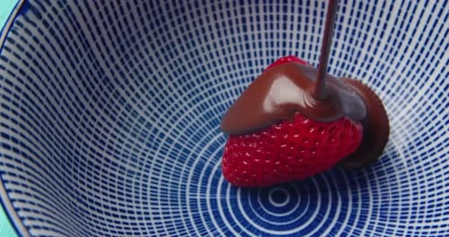 Ripe Juicy Strawberries are Covered with Hot Chocolate