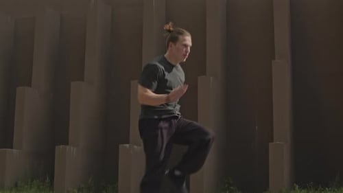 Man Running in Place Outdoors during Workout