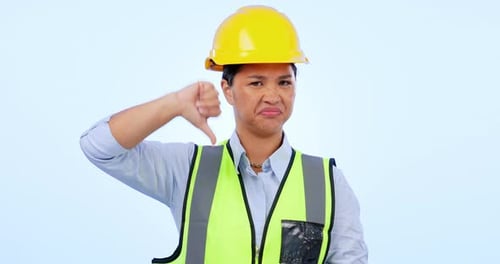 Thumbs down, engineering and construction woman in studio for negative review, bad news and no sign
