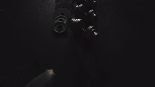 Dumbbells and discs lying on the gym floor. Top down view