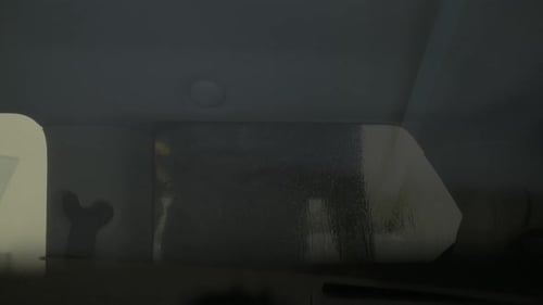 Car side window tinting foil process. Spraying tinting foil