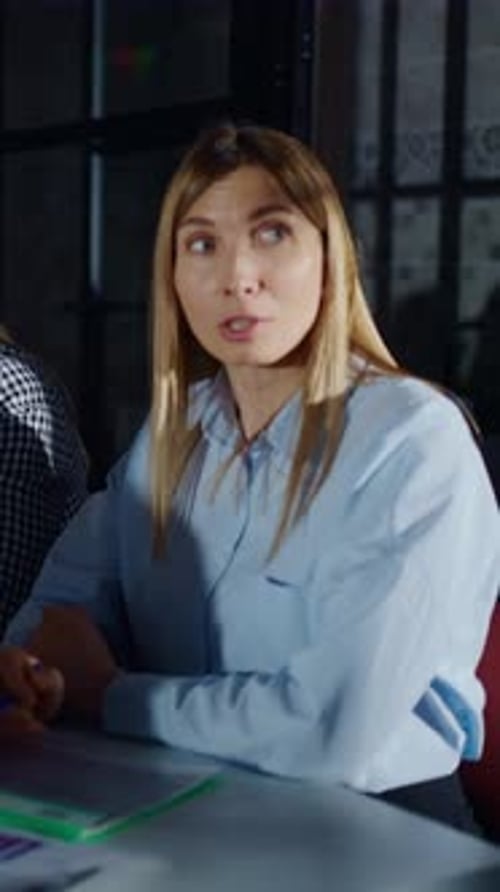 Focused Businesswomen Collaborating in a Modern Office Meeting Listening Attentively and Discussing