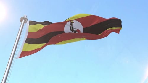Uganda Flag Waving Against Clear Blue Sky