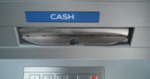 Top View on ATM Machine Dispensing Dollar Bills Cash Withdrawal Transaction