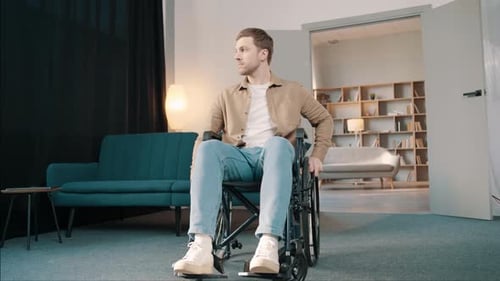 Adult in Wheelchair Seated in Bright Living Room