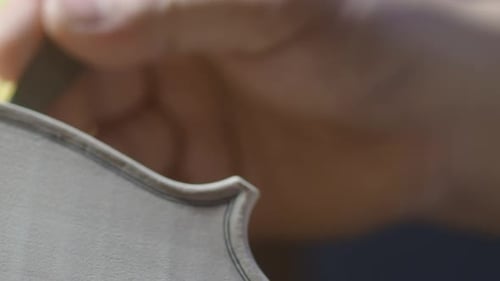 Crafting a Violin: Precision Work on Wooden Instrument