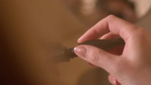 Applying Dark Mascara for Glamorous Look