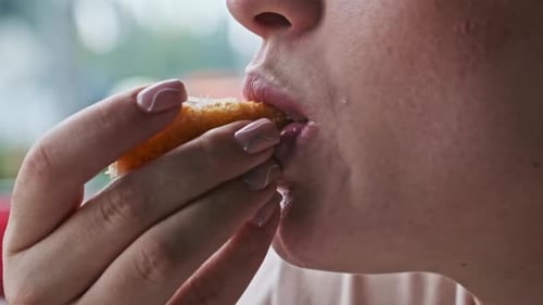 Woman Eating Fried Cheese