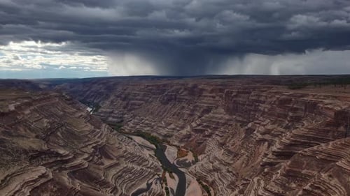 Stunning and Dramatic Canyon Landscape with Intense Storm Clouds Above the Horizon