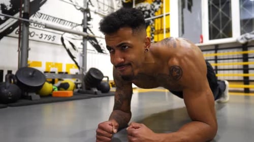 Young Afro American Sportsman Doing a Plank at Sport Club Sporty African Man Strengthens His