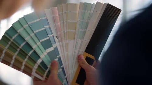 Two People Looking at Paint Swatches
