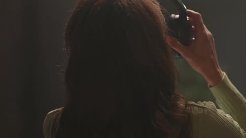 Woman Recording Audio in Professional Studio