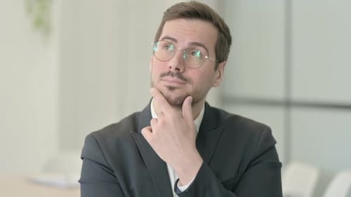 Portrait of Brainstorming Businessman Thinking New Plan