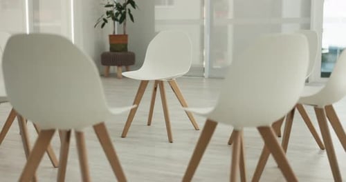 Therapy, group or circle of empty chairs for agency meeting, community center support