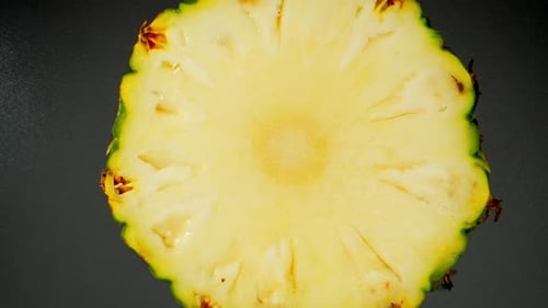 World of pineapple slices up close with a macro video.