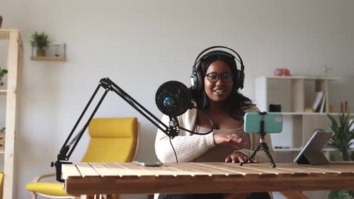 Woman Recording Podcast at Home in Bright Room