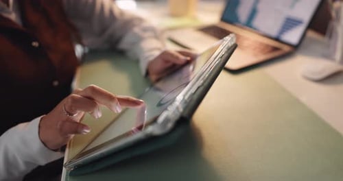 Woman, hands and tablet with laptop for analytics, statistics or performance review in office