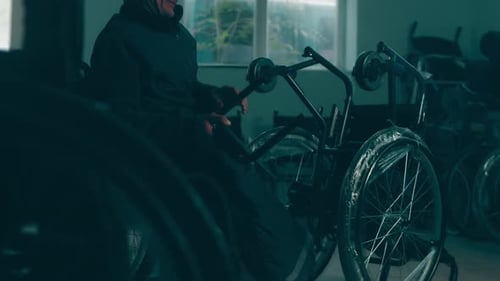 A Disabled Man Assembles a Stroller