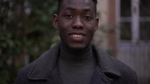 Smiling Young Man in Gray Coat Close Up