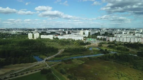 Winding bike path in the city park. City park at dawn. Aerial photography.