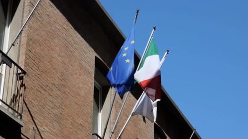 Italian and EU Flags Flying on Building