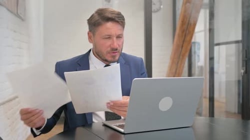 Man working on laptop in the office