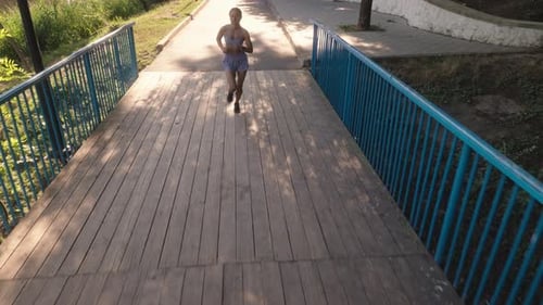 Fitness Woman Running In The Park