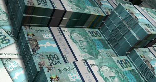 Brazil Real 100 banknote packs - flying over BRL money stack