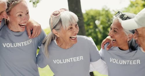 Diverse Group of Happy Volunteers Laughing Together Outdoors