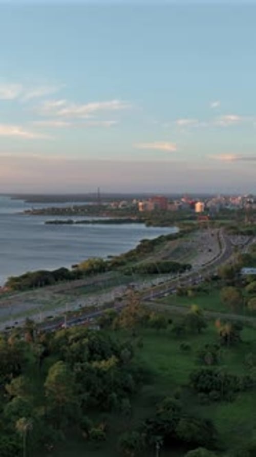 Porto Alegre skyline and Guaiba Lake waterfront at sunset, vertical aerial