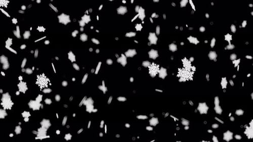 Weiße Schneeflocken fallen langsam herunter mit weichem Fokus