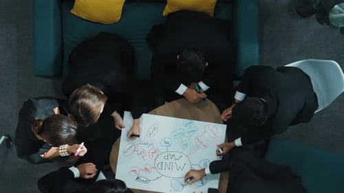 Corporate Team Collaborating on Mind Map in Meeting