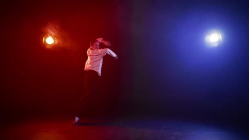 Young Woman Dancing with Red and Blue Lights