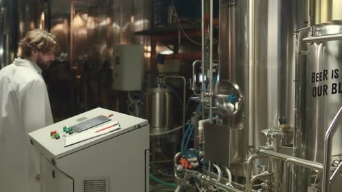 Brewery Technician Checking Fermentation Tank