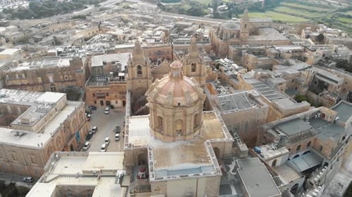 4k aerial drone footage, circling around St Paul's Cathedral in the stone fortified walled city of