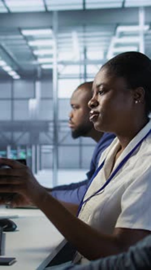 Vertical Video Woman in Server Hub Listening Music While Ensuring Optimal System Performance