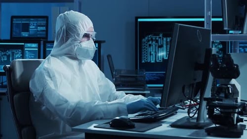 Microelectronics Engineer Works in a Modern Scientific Laboratory on Computing Systems and