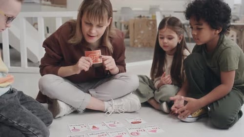 Young Adult Teacher with Children Learning