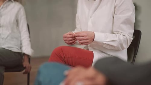 Adults Attending Group Therapy Session in a Bright Room